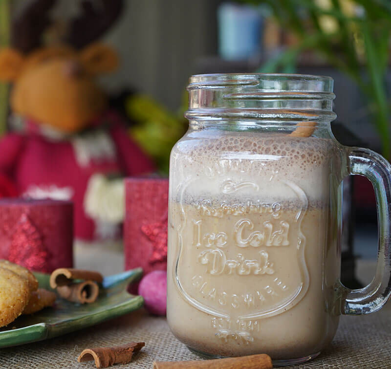 A glass of vegan and dairy-free gingerbread smoothie on a table, Dr. Cherine's recipe