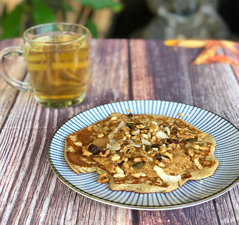 A healthy breakfast of pancakes with honey, dark chocolate, and a cup of chamomile, Dr. Cherine's recipe