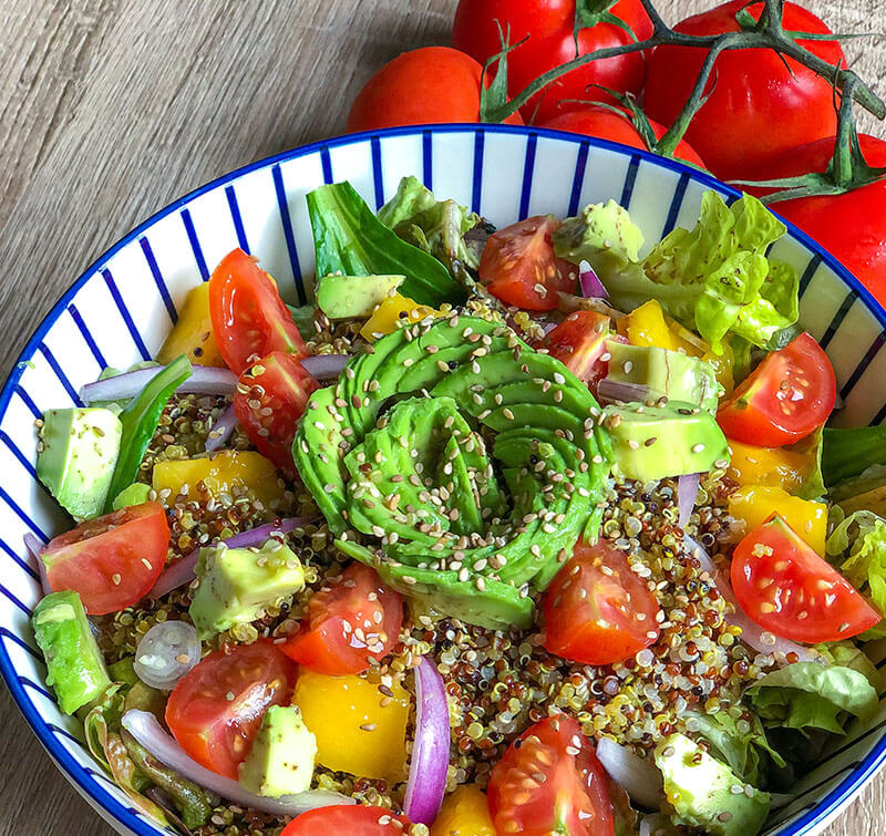 Bowl containing Dr. Cherine's healthy mango quinoa salad recipe