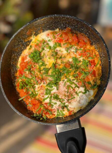 Photo of shakshuka in a pan that can be presented on lunch or brunch, Dr. Cherine's recipe